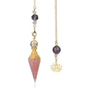May include: Two pendulums with gold chains. One features a pink crystal point with gold filigree, clear and blue beads. The other has a purple sphere and a gold lotus flower charm. Both are suspended against a white background.
