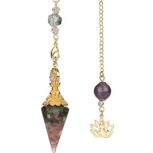 May include: Two pendulums with gold chains. One features a faceted, multi-colored crystal point with gold filigree and clear beads. The other has a purple gemstone and a gold lotus flower charm.