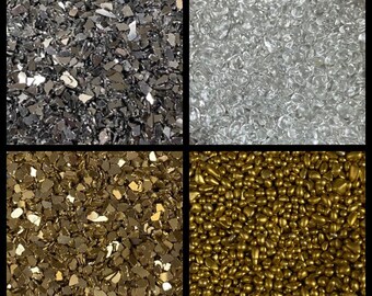 May include: Four different types of glitter, including silver, clear, gold, and gold beads.