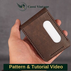 May include: A brown leather wallet with a white accent, held in a hand. The wallet has a stitched border and a rectangular cutout. The image includes the text "Pattern & Tutorial Video" and the Cassi Vintage logo.