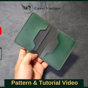 May include: A green leather wallet with a black interior and stitching. The wallet is open and held in a hand. The image includes the text "Pattern & Tutorial Video".