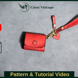 May include: Red leather case with a gold clasp and a heart-shaped charm. The case has a strap and the text "Cassi Vintage" is printed on the front.  A PDF download icon and a YouTube play icon are in the top left corner of the image. The text "Pattern & Tutorial Video" is at the bottom of the image.