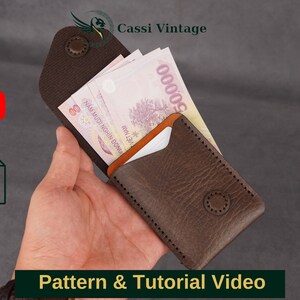 May include: A brown leather wallet with a snap closure, holding Vietnamese currency. The wallet has a textured surface and visible stitching. The image includes the text "Pattern & Tutorial Video".