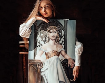May include: A woman holds a painting of a woman wearing a crown and a white dress sitting on a throne. The painting is on a canvas and has a dark background.