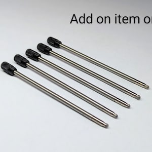 May include: Five silver metal pen refills with black plastic caps. Add on item only.