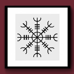 May include: Framed print with a black Vegvísir symbol on a white backdrop. The Vegvísir, a symbol of protection and guidance, is a Nordic compass design. The artwork is presented in a black frame against a dark red background.