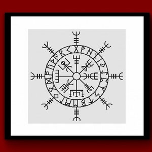 May include: A framed print featuring a black and white Vegvísir symbol, a Viking compass. The symbol is a circular design with runic inscriptions and radiating lines. The print is set against a light gray background and framed in a black border.