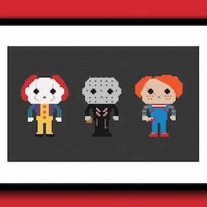 May include: Framed artwork featuring pixelated illustrations of horror movie characters: Pennywise the clown, Jason Voorhees, and Chucky. The characters are depicted in their iconic outfits against a dark gray background. The artwork is framed in a black frame.