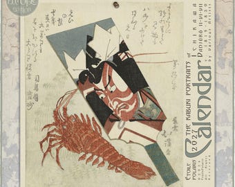 May include: A 2027 wall calendar titled The Kabuki Portraits of Ichikawa Danjuro II-VII by Various Artists. The cover features a traditional Japanese woodblock print illustration of a kabuki actor in makeup and a large red lobster.