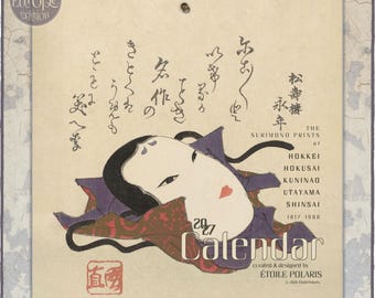 May include: A 2027 wall calendar featuring a beige background with a central illustration of a traditional Japanese mask in black, white, and red. The text includes 'THE SURIMONO PRINTS OF HOKKEI HOKUSAI KUNINAO UTAYAMA SHINSAI 1817 1900' and 'CALENDAR'.