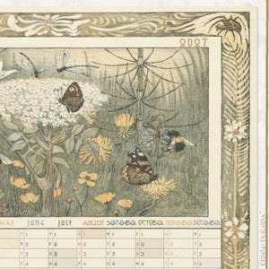 May include: A 2027 wall calendar featuring a detailed botanical illustration of wildflowers, butterflies, dragonflies, and a bumblebee. The artwork is framed by an ornate border with a spider. The calendar grid displays months from May to December.