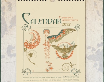 May include: A 2027 wall calendar with a cream background and black spiral binding. The cover features the text "CALENDAR 2027" and "COMBINAISONS ORNEMENTALES-II" with Art Nouveau style illustrations of a woman, wings, a bird, and floral motifs.