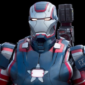 May include: A red, white and blue Iron Man suit with a star on the chest. The suit has a large cannon on the back and the text "FF 2465" on the right shoulder.