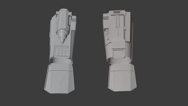 May include: A 3D model of a futuristic drill arm, shown from two different angles. The arm has a drill bit at the end and a series of buttons and controls on the side.