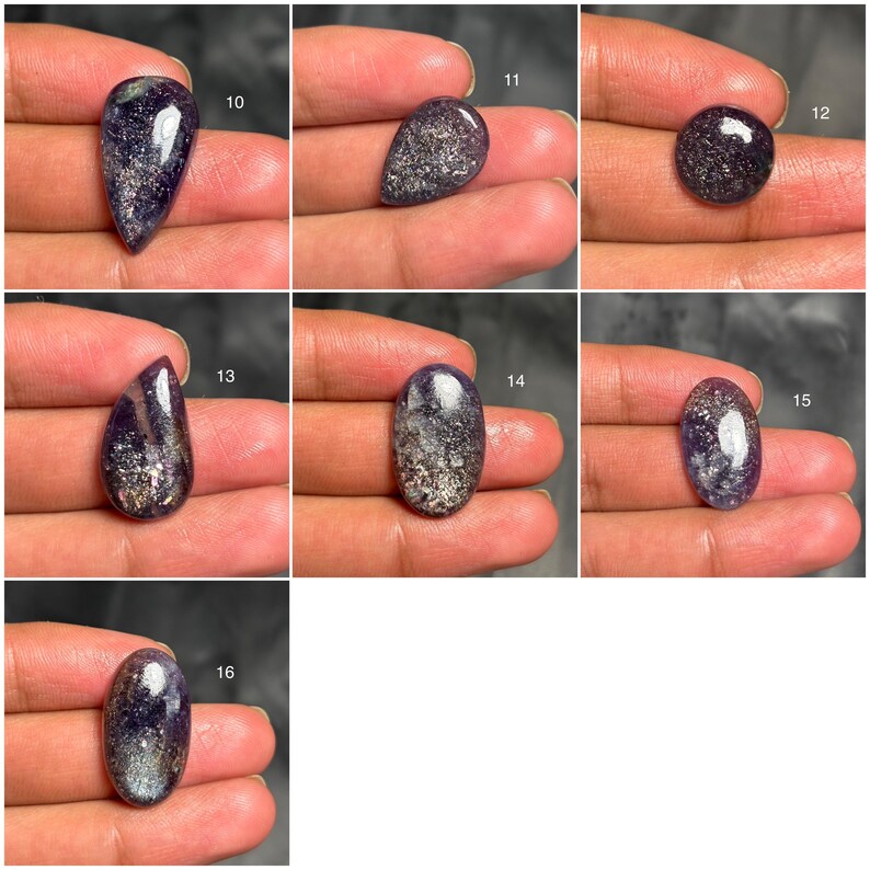 May include: A collection of polished gemstones in various shapes, including teardrop, oval, and round. The stones are a deep purple color with silver and gold flecks throughout, creating a sparkling effect. Each stone is held in a hand.