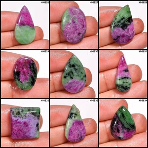 May include: Nine green, pink, and black gemstone cabochons in various shapes, including teardrop and square. The cabochons are arranged in a grid pattern. The cabochons are labelled with the codes H-8626, H-8627, H-8628, H-8629, H-8630, H-8631, H-8632, H-8633, and H-8634.