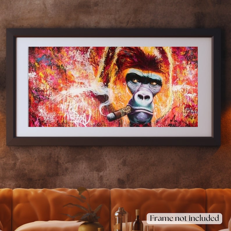 May include: Framed artwork featuring a gorilla smoking a cigar. The artwork has a vibrant, colorful background with graffiti-style accents. The gorilla's face is detailed with a serious expression. The frame is black. Text at the bottom reads "Frame not included."