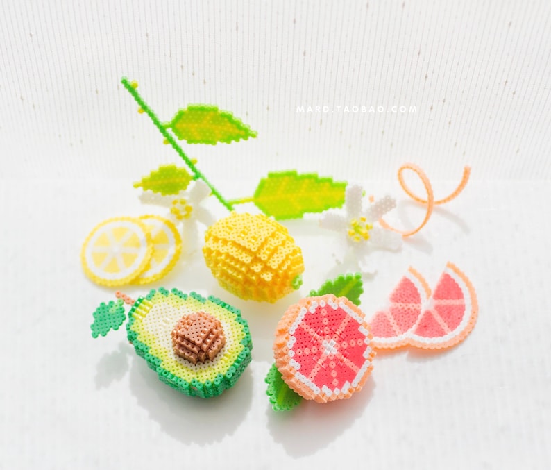 May include: A set of colorful beaded fruit, including a lemon, avocado, grapefruit, and lime, with green leaves. The beads are arranged on a white surface. The text "MARO.TAOBAO.COM" is visible in the upper right corner of the image.