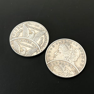 Peut inclure: Deux pièces de monnaie américaines en argent d'un dollar, l'une avec un aigle et les mots "United States of America" et "In God We Trust", l'autre avec le profil d'une femme et les mots "E Pluribus Unum" et "Liberty".