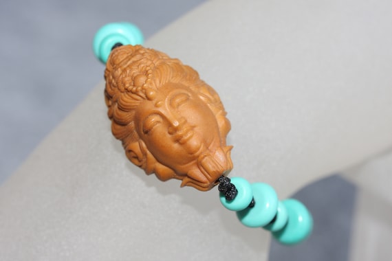 Hand Carved Nut Art Olive Pit GuanYin Face Amulet and Good Luck Bracelet / Braided Rope Turquoise Bracelet/ Yoga Meditation Jewellery