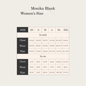 May include: Women's size chart for Monika Blank clothing.  The chart displays measurements in both inches and centimeters for chest, waist, and hips. Sizes range from XS to XXL.  Measurements are provided in numerical ranges for each size. The chart has a clean, minimalist design with a neutral beige background and dark text.