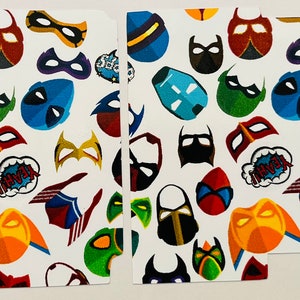 May include: A white background with a repeating pattern of colorful superhero masks. The masks are in various shapes and sizes, and some have text on them, such as "Swoosh" and "Pow!"