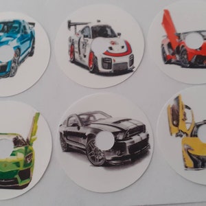 May include: Six circular car illustrations. The cars are in various colors, including blue, white, red, green, black, and yellow. Some cars have their doors open. The illustrations are on white circles with a hole in the center.