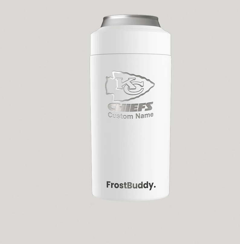 May include: White insulated can cooler with a silver Kansas City Chiefs logo and the text "CHIEFS" and "Custom Name". The cooler also has the text "FrostBuddy." printed on the bottom.