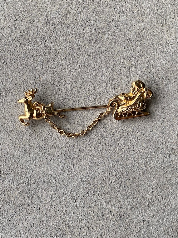 Signed Avon Gold Tone Santa In Sleigh and Reindeer