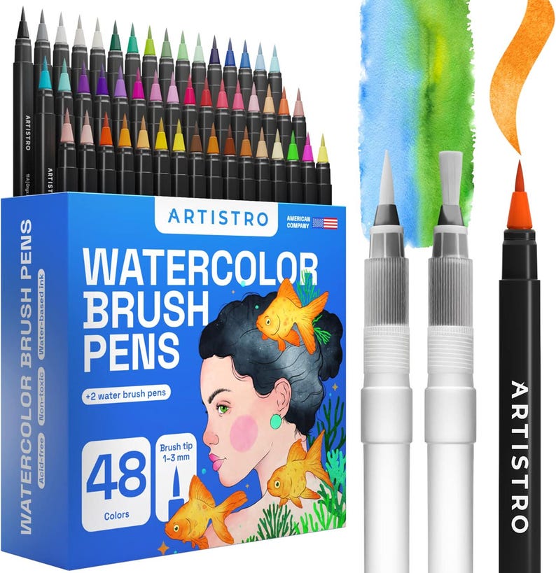 May include: A set of 48 Artistro watercolor brush pens in a blue box featuring an illustration of a person and goldfish. The set includes two clear water brush pens and one orange brush pen with a 1-3 mm tip, shown with a painted orange stroke.
