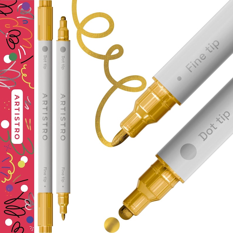 May include: Two gold paint markers with white barrels. One marker has a fine tip and the other has a dot tip. The markers are labeled "ARTISTRO" and have the words "Fine tip" and "Dot tip" printed on the barrels.