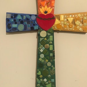 Flaming heart mosaic cross in primary colors