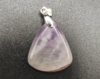 May include: A purple amethyst pendant with a silver bail. The pendant is in the shape of a triangle.