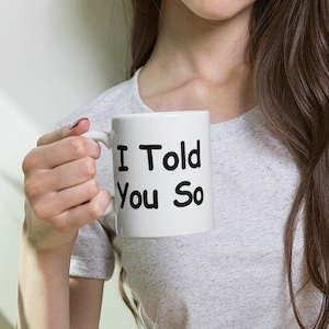 May include: White ceramic mug with black text that reads "I Told You So".