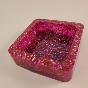 Pink resin ashtray with swirl art