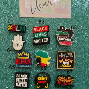 May include: A collection of ten colorful shoe charms featuring various designs and text including #BLM, Black Lives Matter, Black Excellence, Black Girl Magic, and Celebrating Black History, arranged in a grid with numbered labels from 61 to 70.