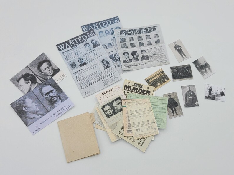May include: A collection of vintage black and white photographs and newspaper clippings related to crime and law enforcement. The images include wanted posters, mugshots, and crime scene photos. The text on the newspaper clippings includes the words "WANTED BY FBI" and "CRIME MURDER $100".