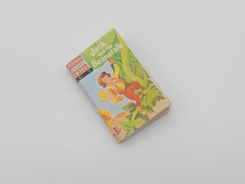 May include: A vintage paperback book titled "Jack and the Beanstalk" from the "Classics Junior" series. The cover features an illustration of Jack climbing a beanstalk with a giant in the background.