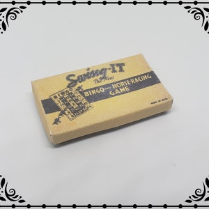 May include: A vintage cardboard game box with the text "Swing-It The New Bingo and Horseracing Game" printed on the front. The box is tan with black text and a black and white image of a bingo card.