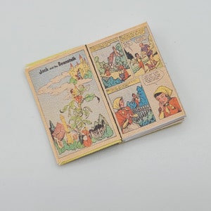 May include: An open vintage comic book titled "Jack and the Beanstalk". The comic book features colorful illustrations of Jack climbing the beanstalk and a giant in a castle.