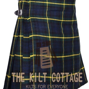May include: A blue and yellow tartan kilt with black buckles and the text "The Kilt Cottage Kilts for Everyone".
