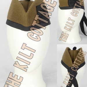 May include: A brown wool military style hat with a black band and a black pom-pom on top. The hat is folded in a triangular shape and has a black patch on the side.