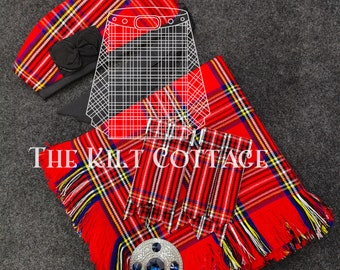 May include: Red and black tartan kilt with a matching red and black tartan hat and a blue jeweled brooch. The kilt has fringe around the edges. The text "THE KILT COTTAGE" is visible on the kilt.