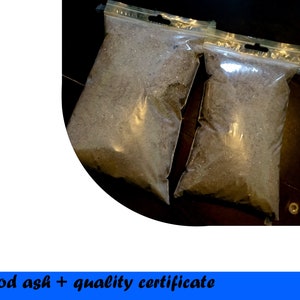 May include: Two clear plastic bags filled with wood ash. The bags are sealed with a zipper closure. The text "Wood ash + quality certificate" is visible below the image.