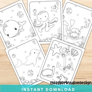 May include: Five black and white colouring pages featuring various sea creatures, including an octopus, a whale, a dolphin, a diver, and an anchor. The pages are designed for children to colour.