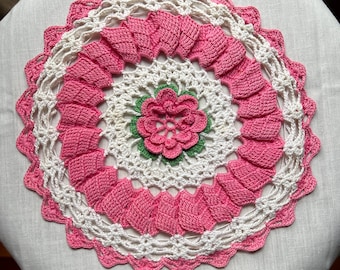 Handmade vintage crochet doily with pink rose center and scalloped edge