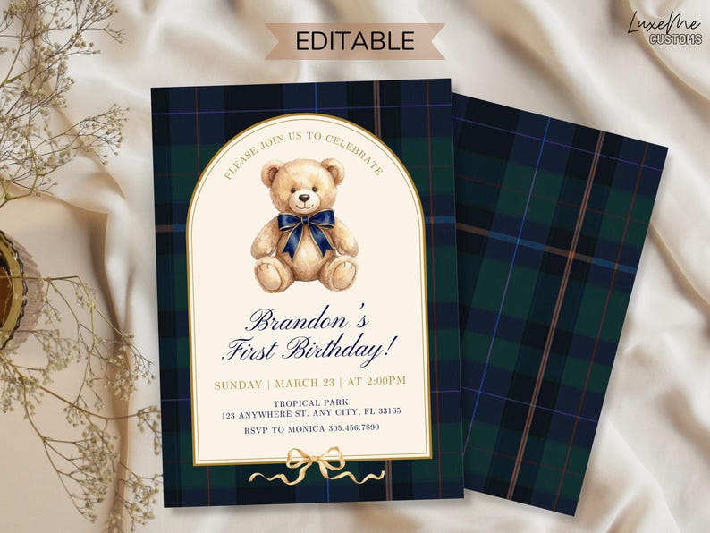 May include: An invitation card with a teddy bear illustration and the text "Brandon's First Birthday!" on a cream background. The card has a navy blue and green plaid pattern. The text "Please join us to celebrate" is at the top.