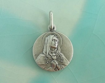 Beautiful vintage Virgin of the 7 Sorrows religious medal in matte metal