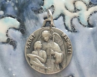 Beautiful vintage religious medal of Saint Raphael the Archangel in metal