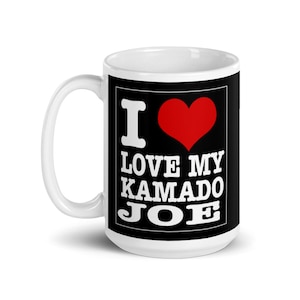 May include: White ceramic mug with a black square design. The design features a red heart and the text "I LOVE MY KAMADO JOE".